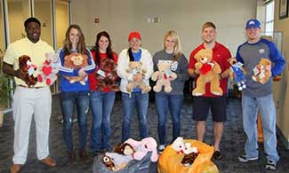 UWG Athletes Distribute Bear Toss Bears 