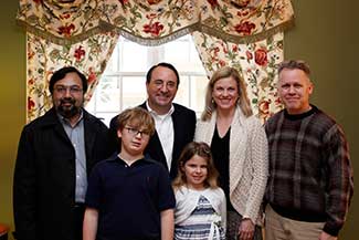 Photo: From left to right (top row) – Dr. Farooq Khan, Bill Esslinger, Debbie Esslinger, Dr. Spencer Slattery. From left to right (bottom row) – Will Esslinger and Belle Esslinger