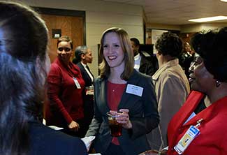 Rachel Skolrood, a UWG senior in accounting, networks with Walmart representatives. 